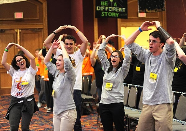 Members of the Diocese Youth Council rock out to the Catholic sounds of the Carrie Ford Band in the Grand Ballroom of the Adams Mark Hotel during the 